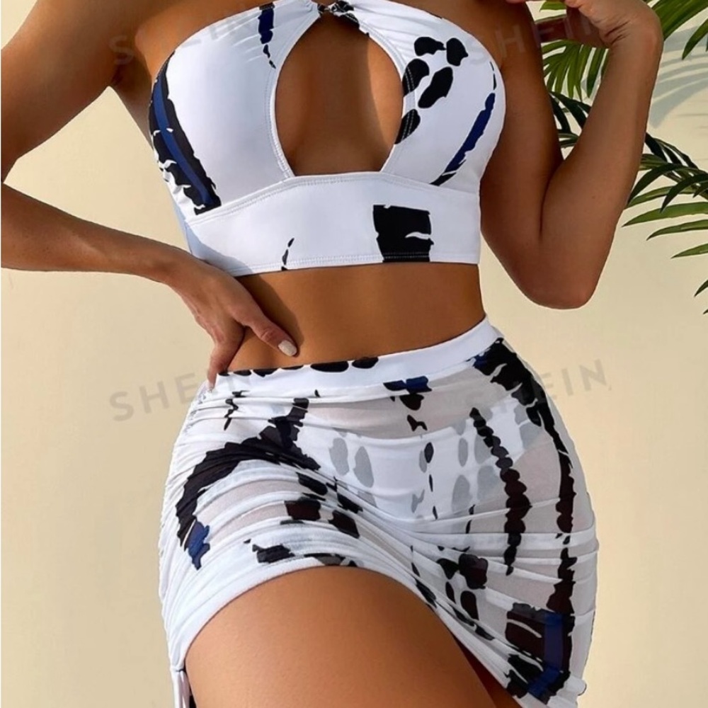 Large 3 piece shein swimsuit. Top has cut out. And mini mesh skirt coverage